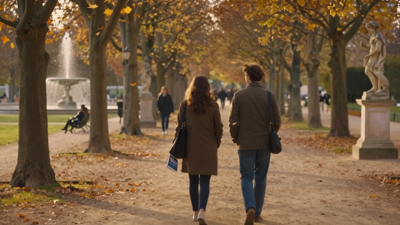 Two people walking peacefully through Luxembourg Gardens at golden hour.